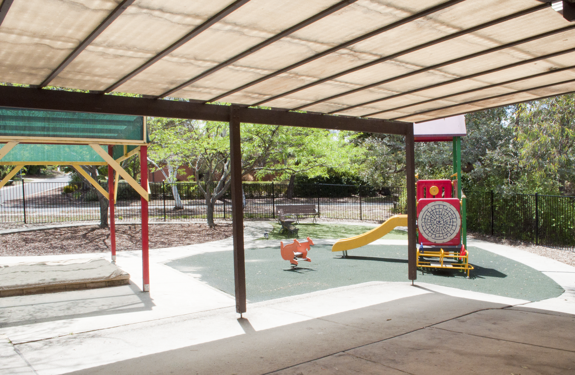Exterior of Nellie Hall showing covered outdoor area.